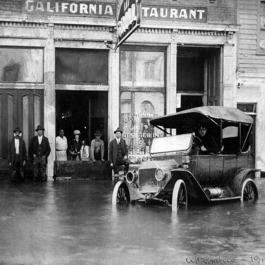 flooded mainstreet with old timey car