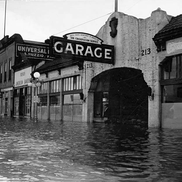 flooded street with large garage sign